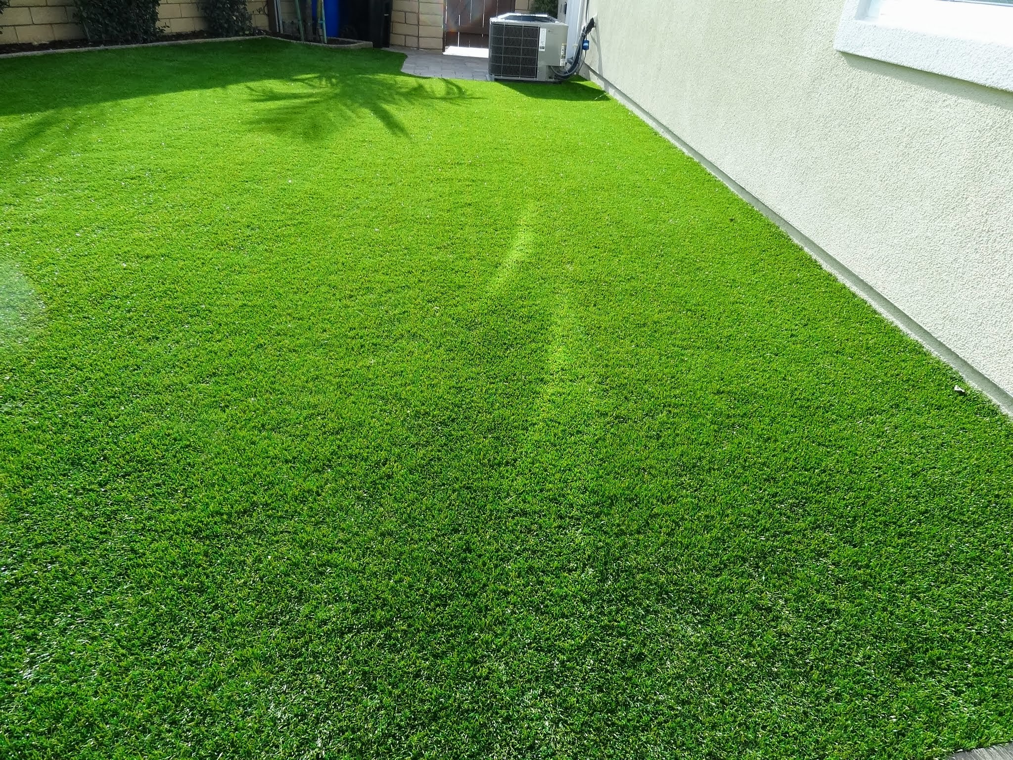 Energy-Efficient-Windows-Melting-Artificial-Grass